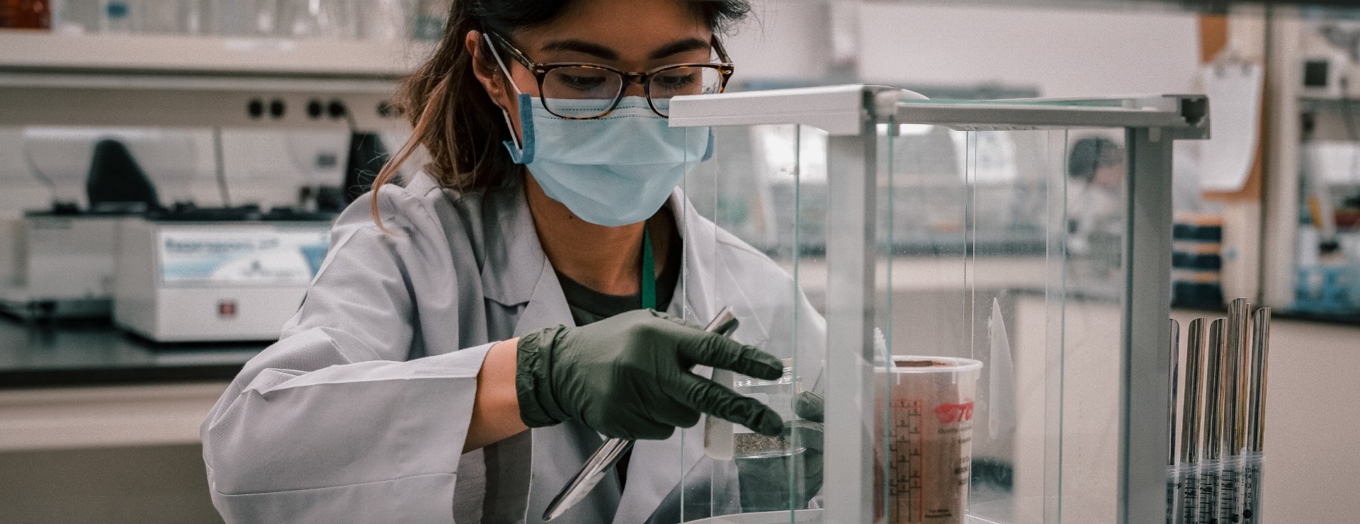 Young lab tech handling samples for testing.